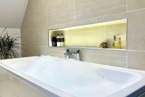 The deep, 2 person bubble bath at Bluebell Cottage Glencoe is ideal for soaking in.