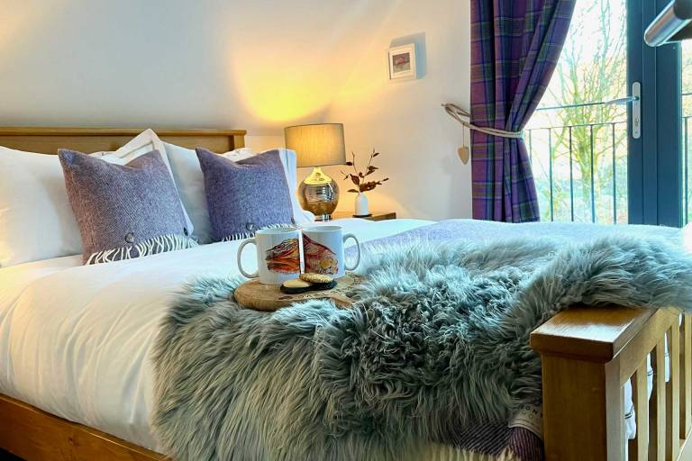 One of our kingsize bedrooms at Bluebell Cottage Glencoe, this one with gorgeous juliette balcony.